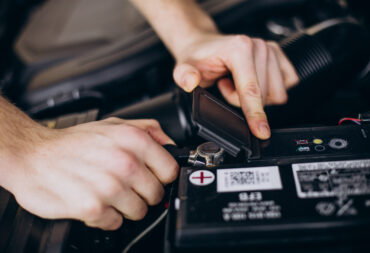 Repair man making car service