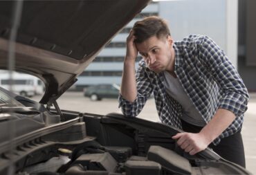 young-man-trying-repair-car